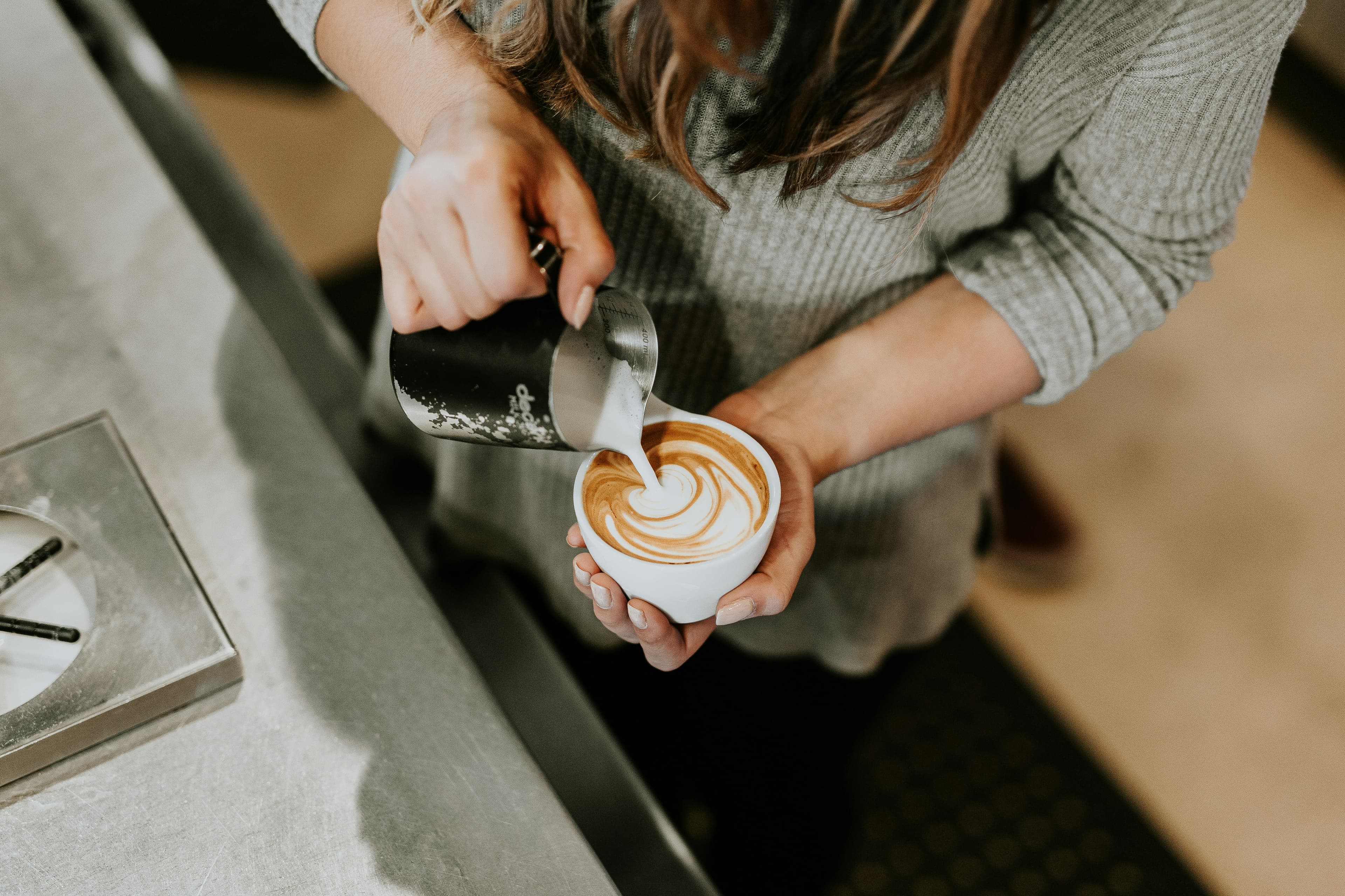 Cafe barista preparing coffee