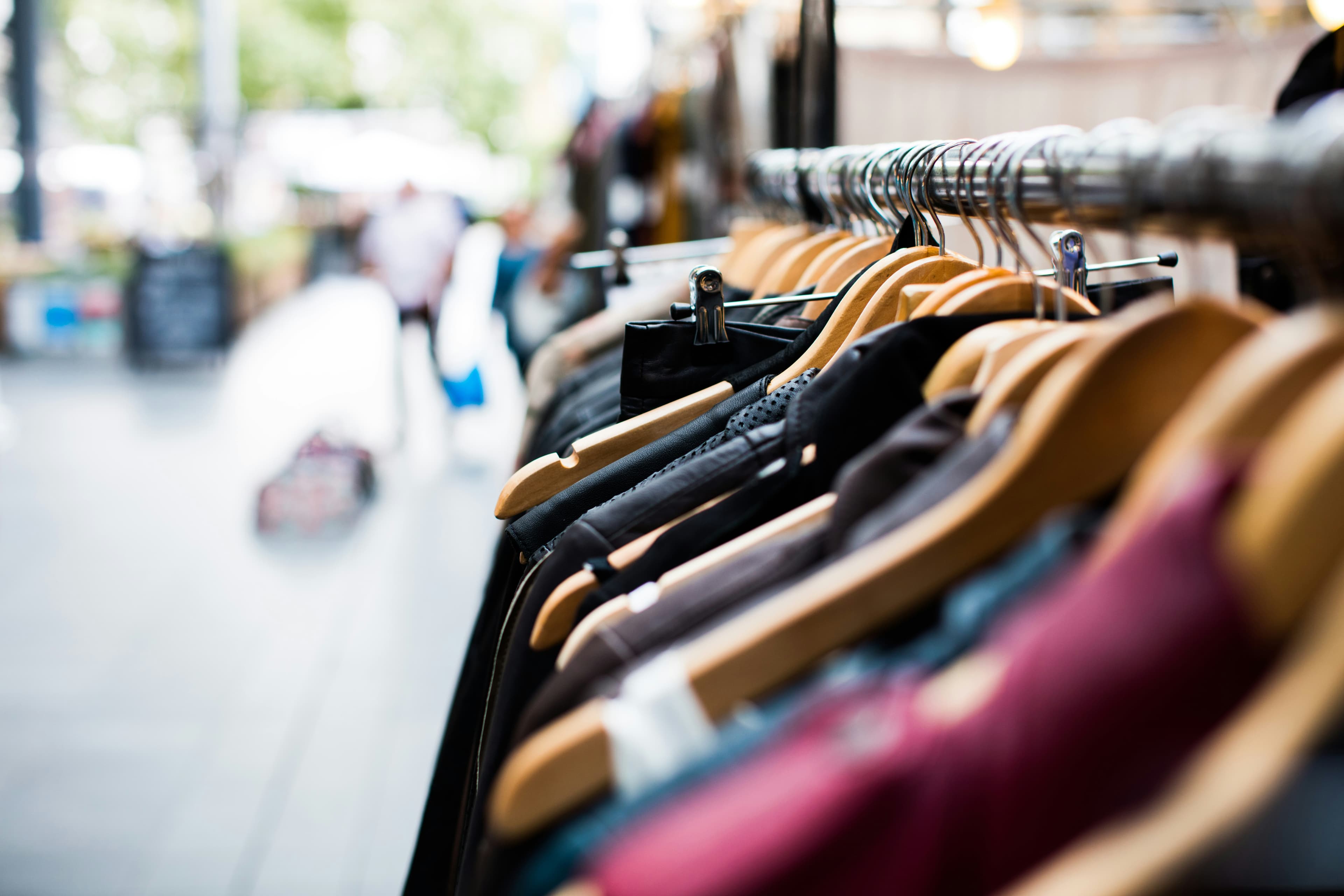 Retail store employee organizing merchandise